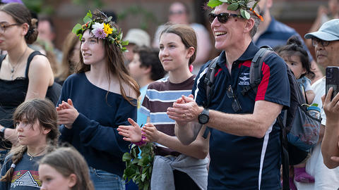 Guests at Summer Solstice wearing flower crowns.