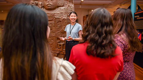 A tour guide shows guests around the Peabody.