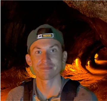 Dan Crocker inside of a cave.