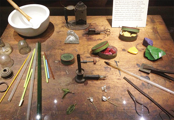 Work table with glass and glass tools.
