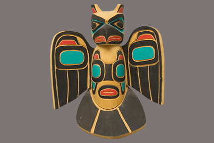 Carved artifact of a raven.
