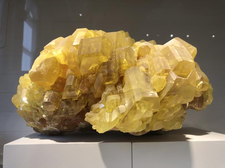Yellow crystal in museum gallery
