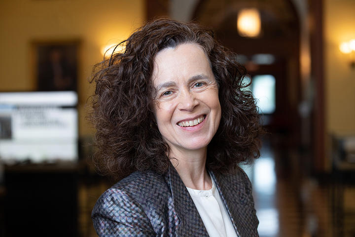 Woman, Rebecca Henderson, smiling at the camera.