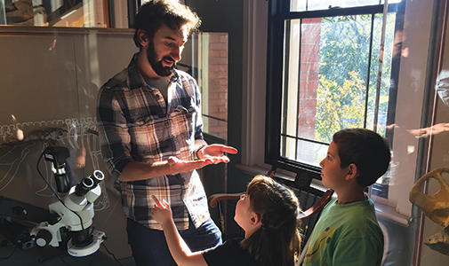 Photo of Harvard Student teaching children
