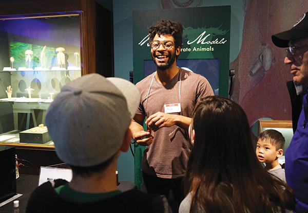 Diverse group learning about fossils.