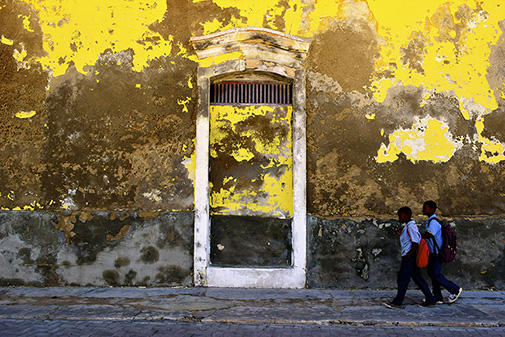 School Walk by Cauvery Patel. A couple of Mozambican students walk to school in the early morning hours of May on Ilha de Moçamb