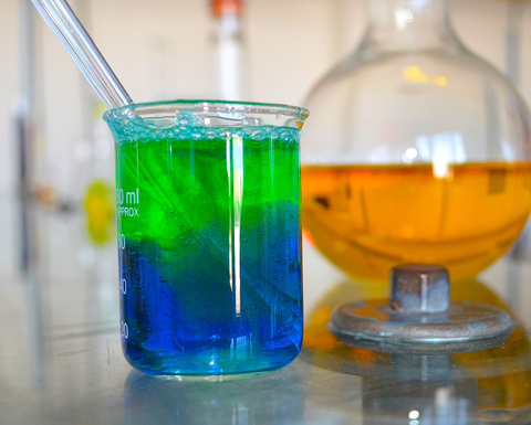 Lab equipment filled with colorful slime.