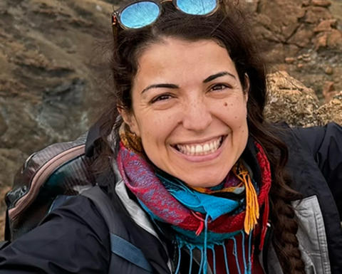 A headshot of Federica Calabrese smiling.