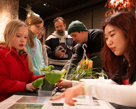 Guests looking at educational materials provided by scientists.