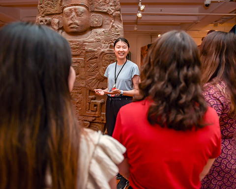 A tour guide shows guests around the Peabody.